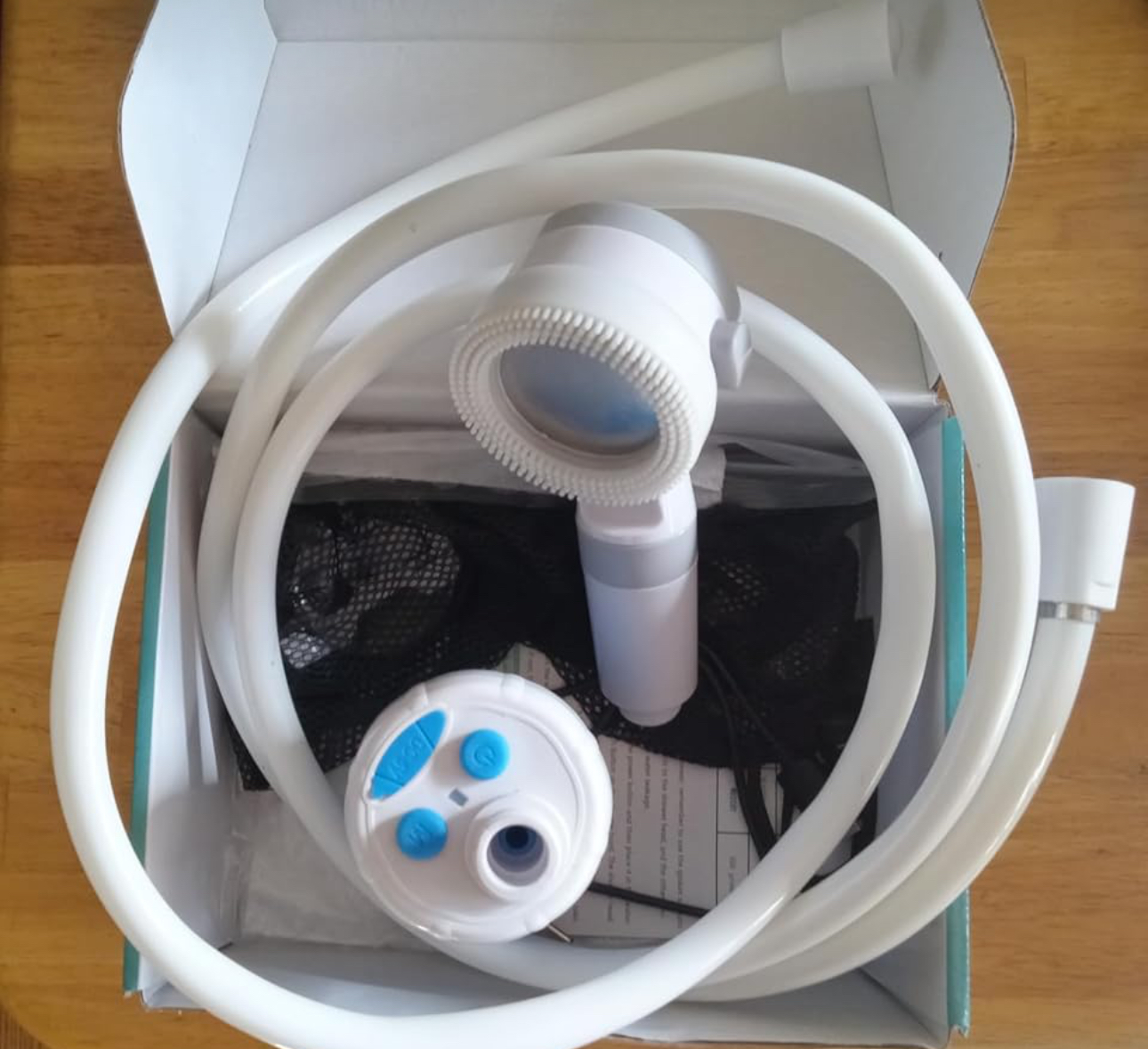 Portable shower packed in its box