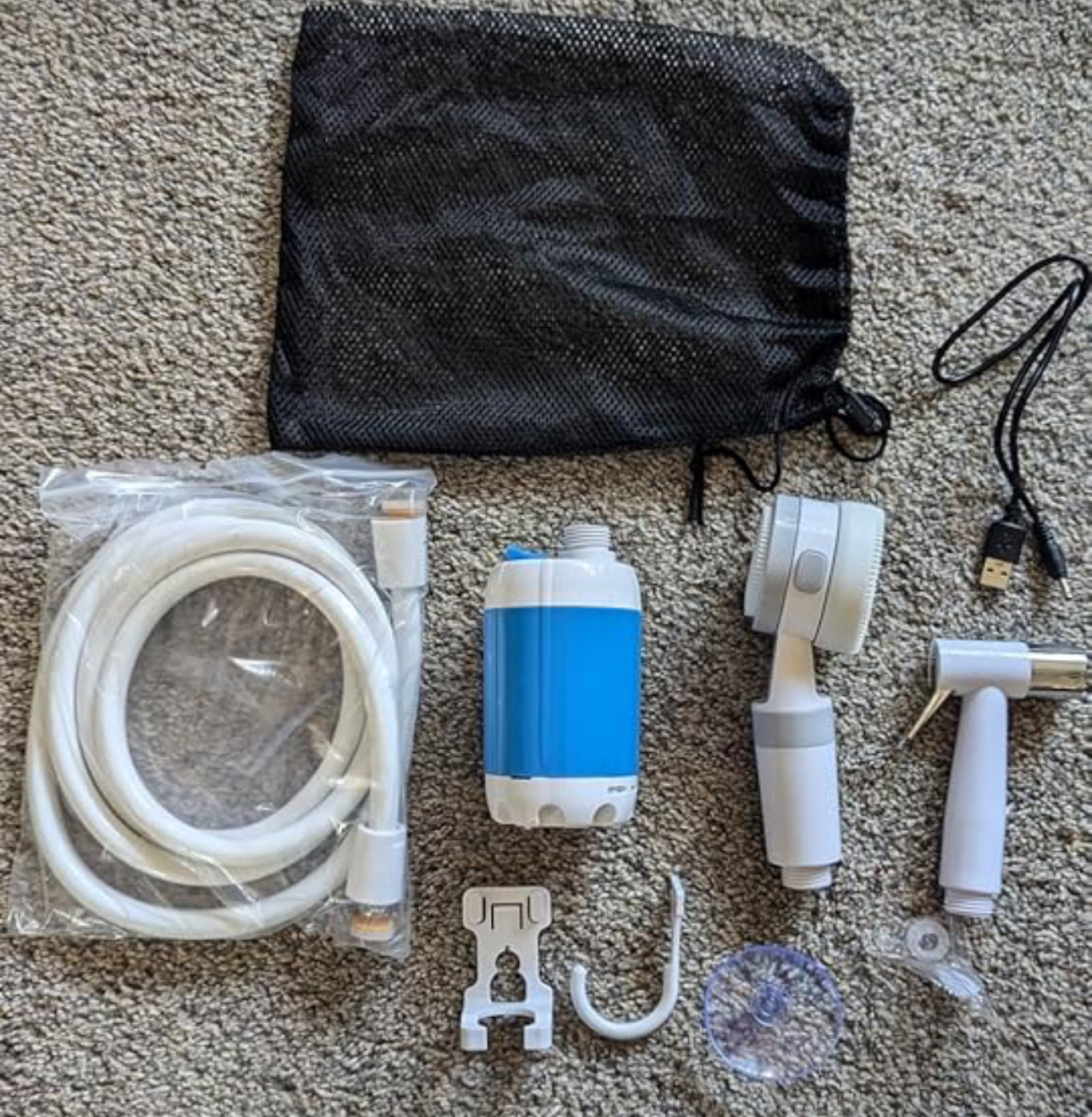 Full Shower Anywhere kit laid out on the floor